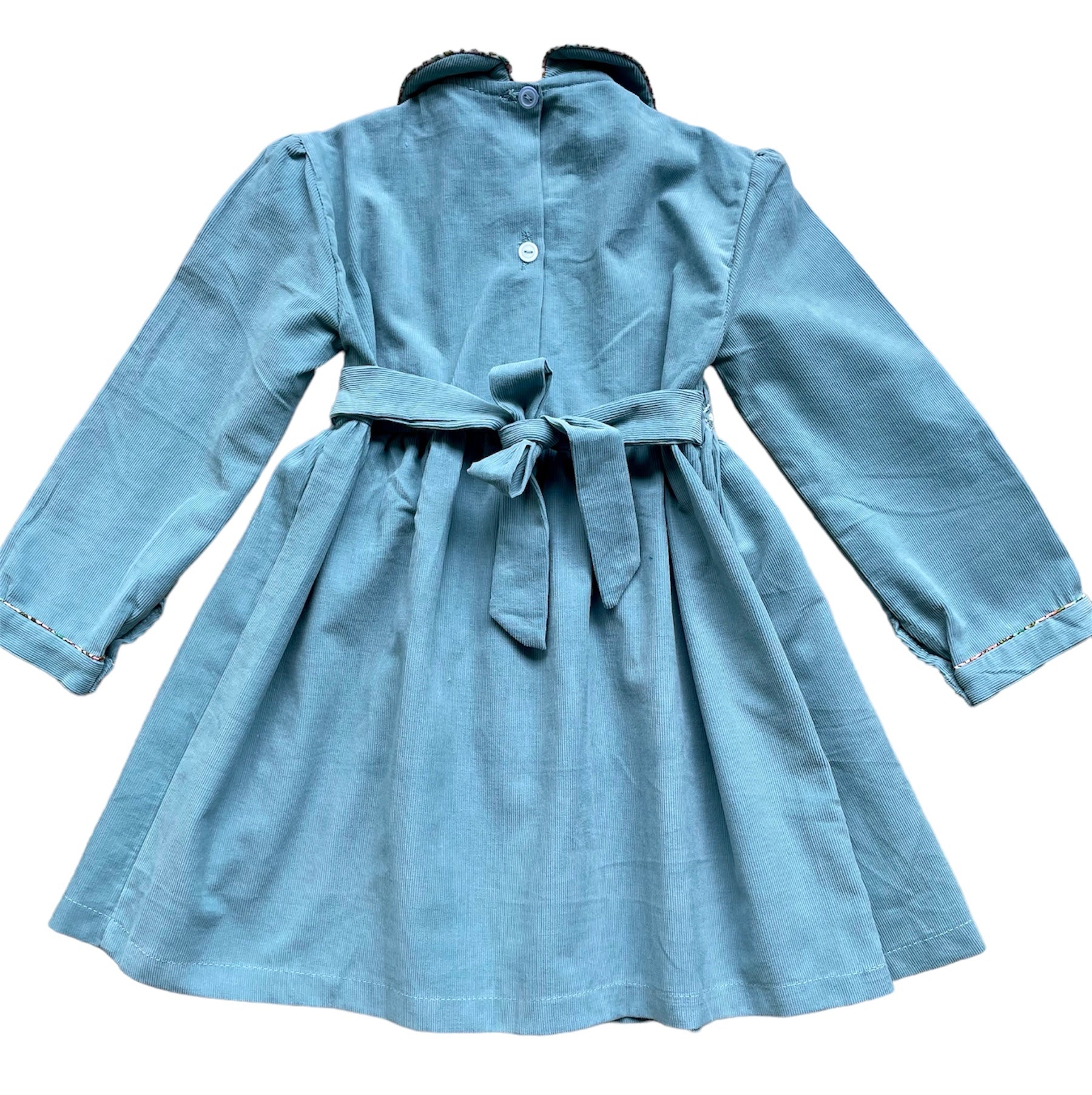 Robe smocks manches longues en tissu finette imprimé petites fleurs roses Robe smocks manches longues en tissu finette imprimé petites fleurs roses
